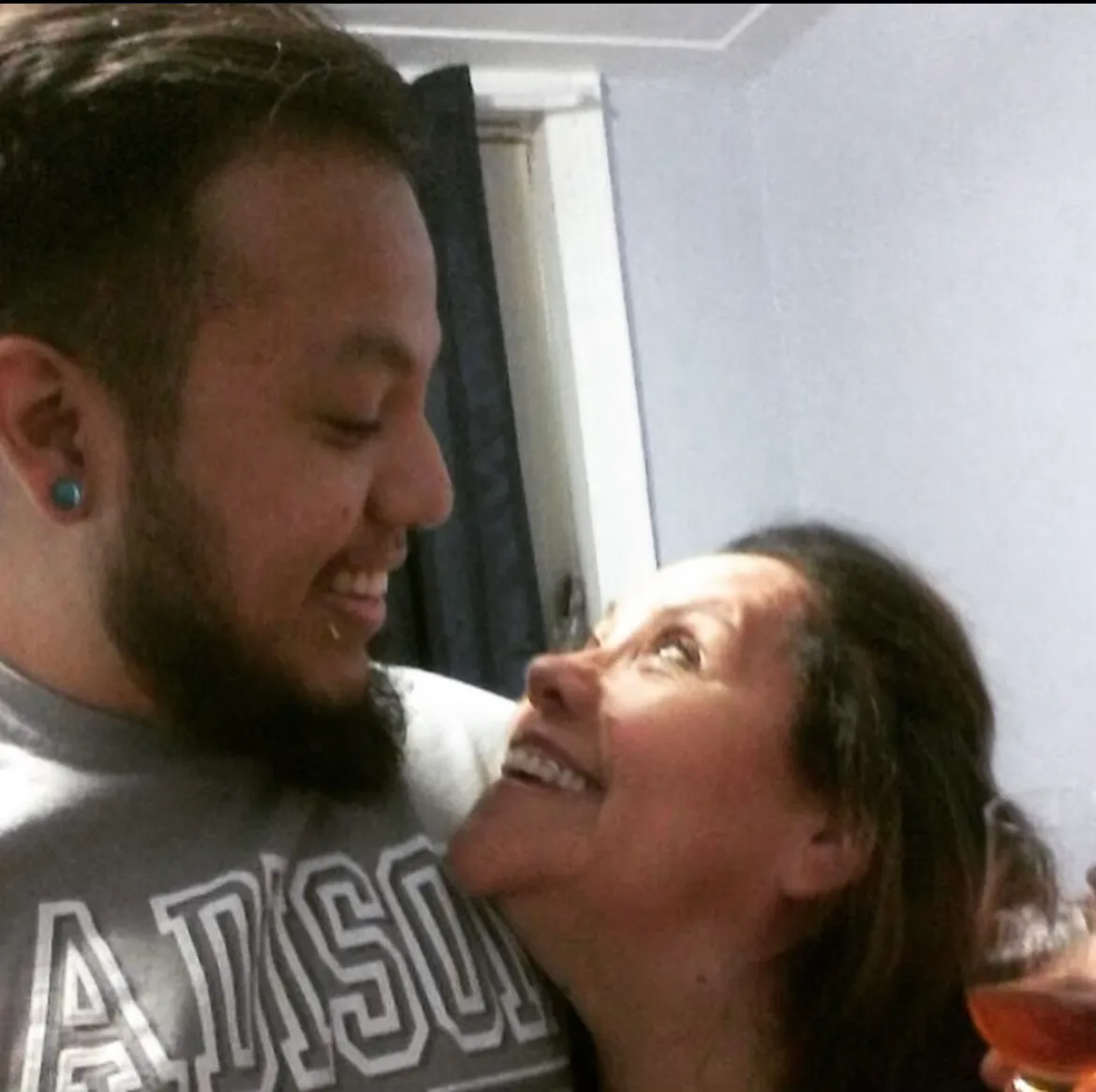 Two people smiling at each other.