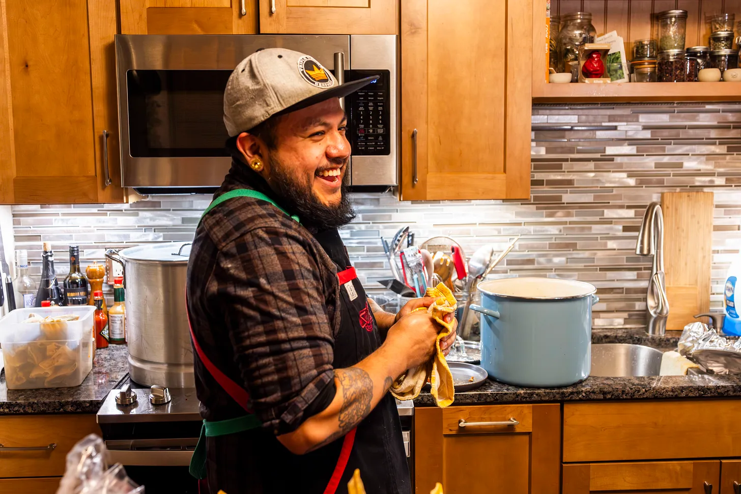 Jeremy laughing in the kitchen.