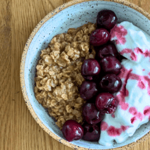 Bowl of tea-infused oatmeal topped with meringue and fruit
